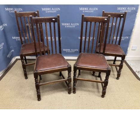 A set of four early 20th Century oak dinning chairs with bobbin turned front legs together with a panel seated provincial din
