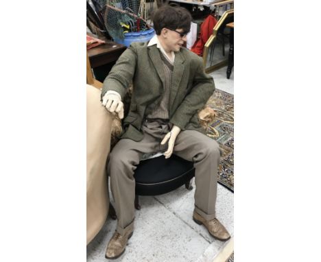 A vintage male mannequin in agricultural tweed jacket and brogues