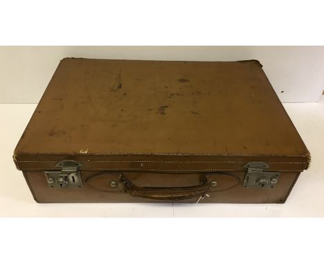 A vintage brown leather suitcase 