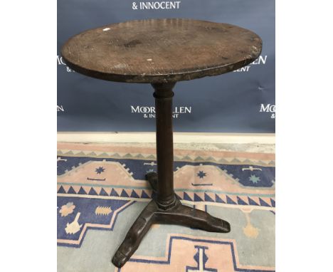 A circa 1700 oak occasional table, the single piece top on a turned and ringed tapering pedestal to tripod splayed base, 44.5