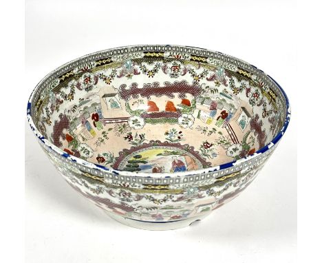 A last quarter 18thc exceptionally large English Pearlware transfer printed Chinese Canton style punch bowl, the outside with
