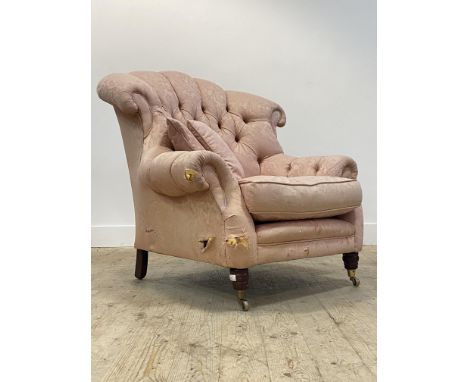 A Victorian style button back armchair, upholstered in pink damask fabric, raised on turned supports with brass castors, H100