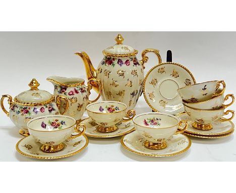 A Rudolf Wachter 'Bavaria' part tea set decorated with floral sprays and gilt/gold-overlay comprising a teapot (h- 18cm, w- 1