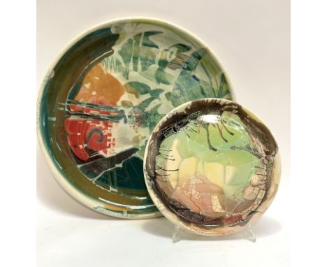 Unknown artist - De Srandau?, two decorative ceramic chargers, with abstract drip glaze, larger charger depicting a under the