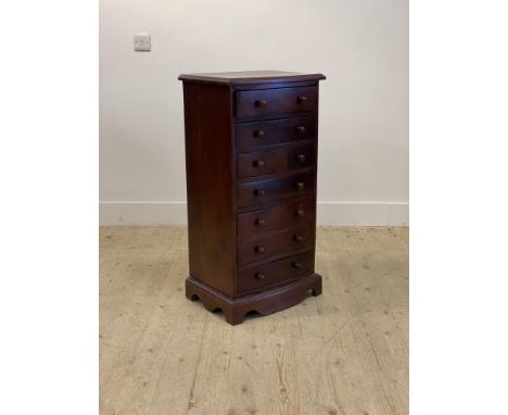 A Victorian style mahogany bow front chest fitted with seven drawers, raised on bracket supports H94cm, W50cm, D39cm