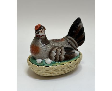 A ceramic hand-painted hen nesting egg holder. (w- 21cm h-18cm) ( chips to base rim)