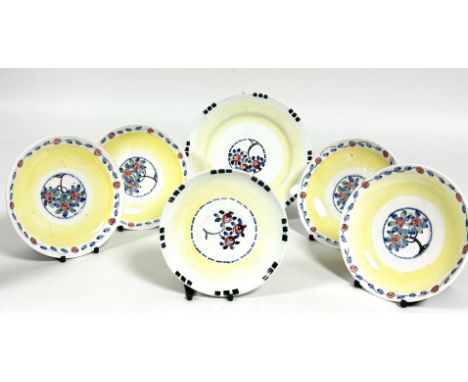 A Mak Merry Scottish Pottery group of six plates including a side plate, (D x 18cm), a set of four large saucers,(D x 15cm) a