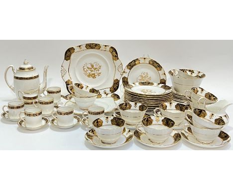 A mixed china tea service comprising black and gold Standard China with arts and crafts style decoration: a teapot (h- 17.5cm