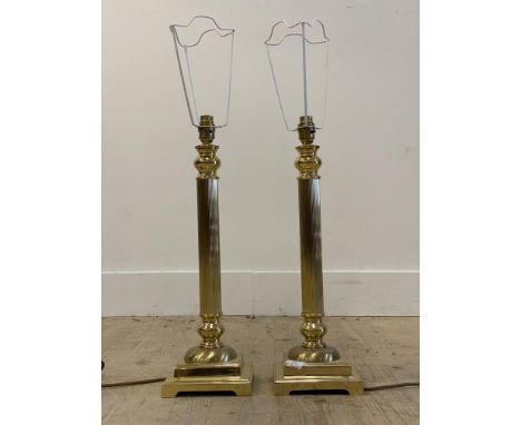 A pair of cast gilt brass table lamps of architectural column form, on square bases, H50cm