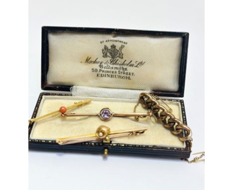 A 9ct gold bar brooch set pink coral bead, (L x 4cm), an Edwardian yellow metal bar brooch set shell with seed pearl, (L x 5c