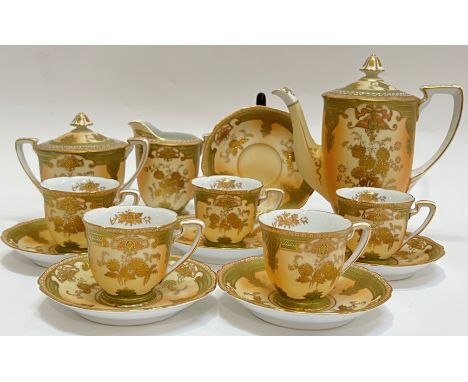 A Noritake blush china part tea set  decorated with raised gilt comprising five cups, six saucers, a twin-handled sugar bowl 