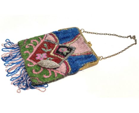 A 1920's-30's gilt metal evening bag with hand stitched panel design to front and and back with fringed border to bottom (L x