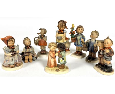 A collection of eight Hummel German pottery figures including, Cinderella, Friends Together, Be Patient, Coffee Break etc. (T