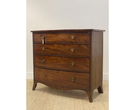 A Regency mahogany bow front chest, fitted with four long graduated drawers having ebonised string inlaid borders, raised on 