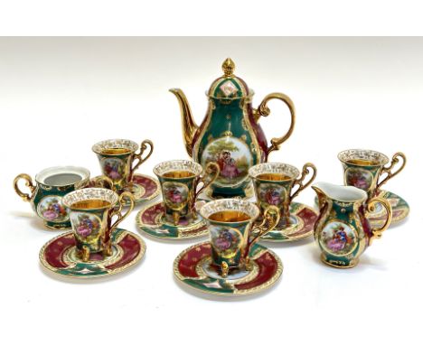 A desden style espresso set on baluster form comprising six espresso cups, six saucers, a coffee pot (h- 20cm), a milk jug (h