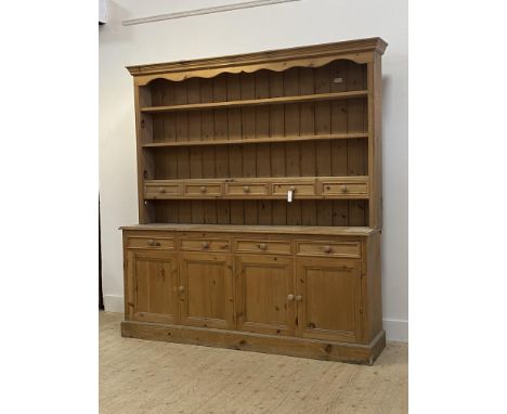 A Victorian style pine dresser, the three height plate rack fitted with five spice drawers, above four drawers and panelled c