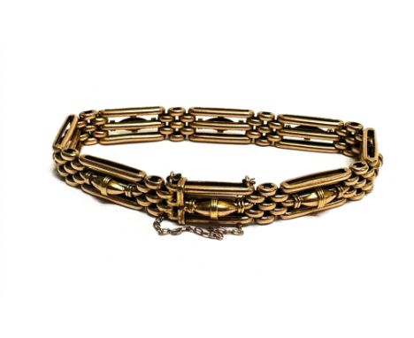 A Edwardian 15ct gold gate link bracelet with oval bead barrel central panels and safety chain, (D x 7cm) 19.8g, shows no sig