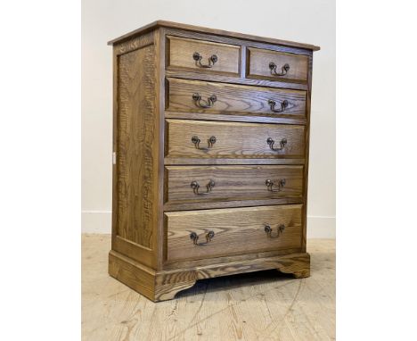 A tradiational elm and ash chest fitted with two short and four long graduated drawers, raised on bracket supports H105cm, W8