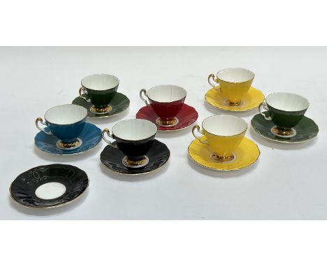 An Adderley Bone China group of  various coloured tea cups and saucers comprising of yellow, red, black, green and blue with 