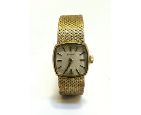 A Lady's Eterna 9ct gold wrist watch, the silvered dial with baton hour markers, (D x 1.5cm) on milanese integral strap with 