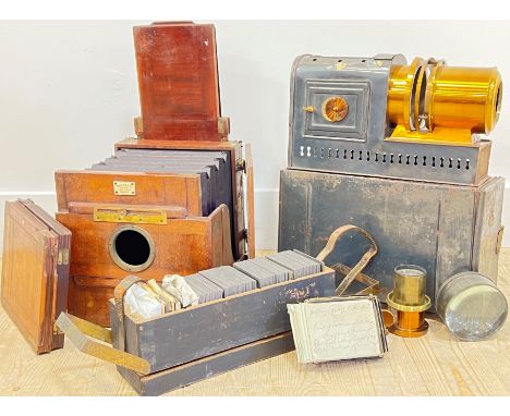 A magic lantern with boxes of glass slides and lenses, marks for Marion &amp; Co etc...