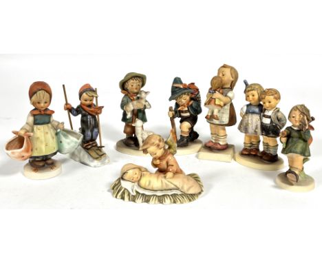 A collection of  eight Hummel German pottery figures including, Mothers Darling, Gay Adventure, Shepherd's Boy, Kiss Me, The 