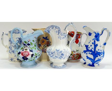 A mixed group of jugs comprising an early Victorian Copeland and Garrett sleigh topped jug with blue and white transfer print