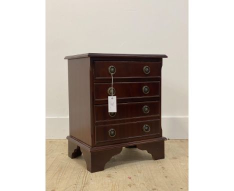 A Georgian style mahogany bedside chest, fitted with three drawers, raised on bracket supports H51cm, W44cm, D30cm