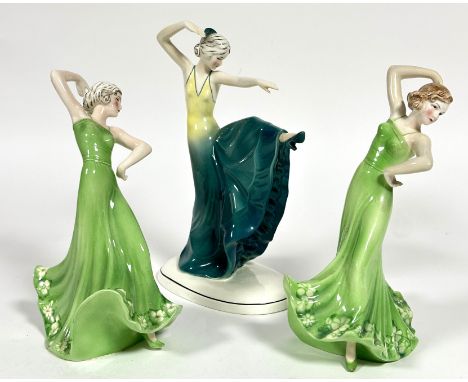 Katzhutte, a group of three porcelain  Art Deco dancing figures in green evening dresses, one with Spanish comb in her hair a
