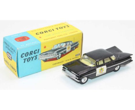 A Corgi Toys No. 223 Chevrolet State Patrol Police car, comprising of black body with State Patrol stickers, fitted with yell