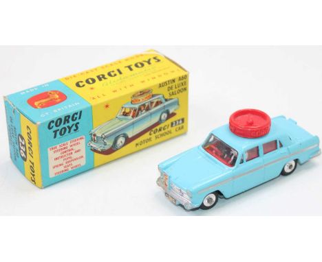 A Corgi Toys No. 236 Austin A60 Motorschool Car, comprising of light blue body with red interior, driver figure, and instruct