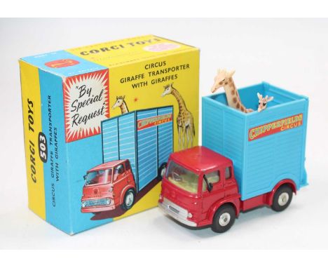 A Corgi Toys No. 503 circus giraffe transporter, with two giraffes, comprising of red cab and chassis with blue back, spun hu