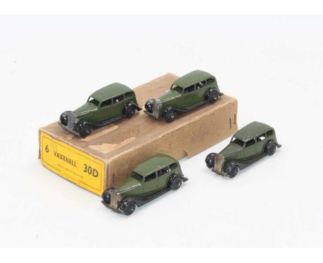 Dinky Toys No.30d original Vauxhall Trade box containing 4 examples in green some with age-related wear.