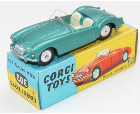 A Corgi Toys No. 302 MGA sports car, finished in metallic green with cream seats and spun hubs, housed in the original blue &