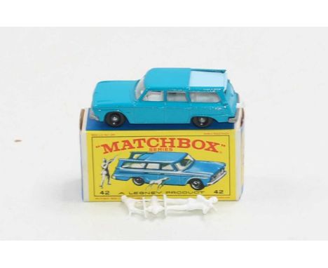 A boxed Matchbox no.42 Studebaker Station wagon in dark blue with light blue metal slide roof,(one small chip, otherwise mint