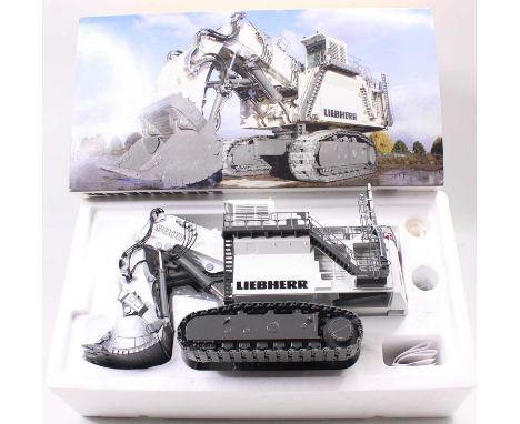 Conrad No.2942 1/50th scale diecast model of a Liebherr R9800 Mining Excavator, finished in white and grey, appears complete,