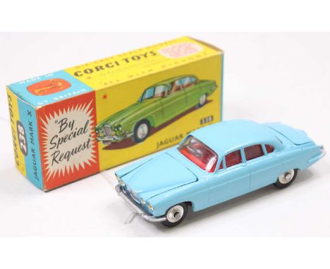 A Corgi Toys No. 238 Jaguar Mk X finished in light blue with red interior and luggage load, complete with spun hubs and house