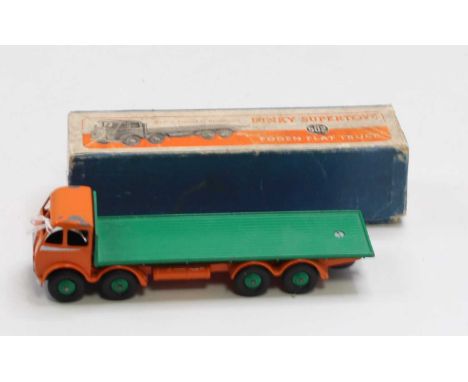 A group of 3 boxed Dinky Toys 1st type Fodens as follows: 502 Foden flat truck, green cab and load bed, black chassis in play