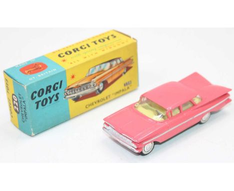 A Corgi Toys No. 220 Chevrolet Impala, comprising of pink body with yellow interior, silver side flash with white walled tyre