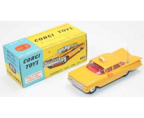 A Corgi Toys No. 21 Chevrolet New York Taxi Cab comprising of yellow body with red interior, grey rear aerial and flat spun h