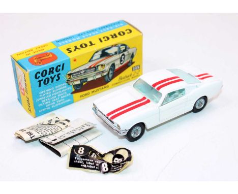 A Corgi Toys No. 325 Ford Mustang Fastback 2+2 competition model, comprising of white body with red twin racing stripe, light