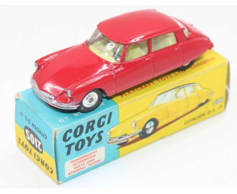 A Corgi Toys No. 210S Citroen DS19 comprising of red body with yellow interior and spun hubs, house din the original blue &am