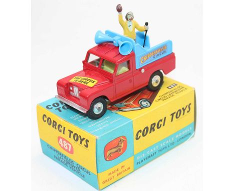 A Corgi Toys No. 487 Chipperfield Circus Land Rover Parade vehicle comprising of red body with blue back, standing figure, an