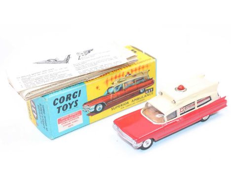 A Corgi Toys No. 437 Superior Ambulance comprising red and cream body with brown interior and spun hubs, with battery box to 