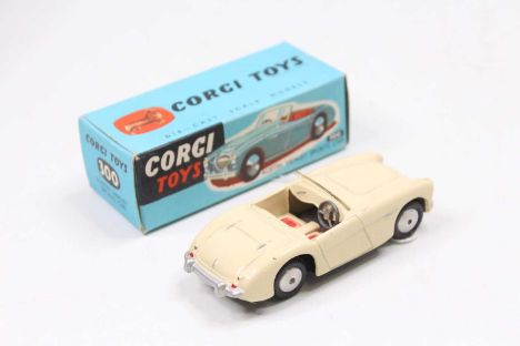 A Corgi Toys No. 300 Austin Healey sports car, comprising of cream body with red seats and windscreen, complete with flat spu