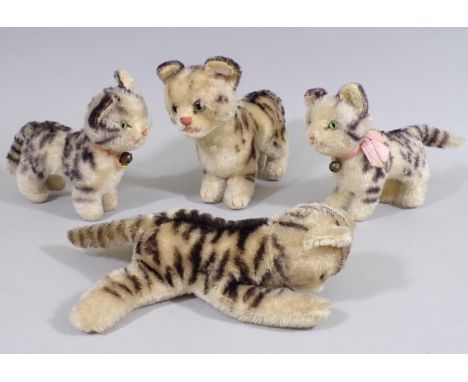 2 tabby kittens by Steiff and 2 similar unmarked cats which are probably Steiff, circa 1950's. Tallest is 16cm (4) 