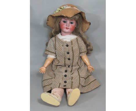 An early 20th century German bisque head doll by Schoenau &amp; Hoffmeister, 1906, mould 15, with blue sleeping eyes, open mo
