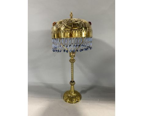 An unusual bohemian brass table lamp with Islamic type beaded shade and Regency style column 45cm high 