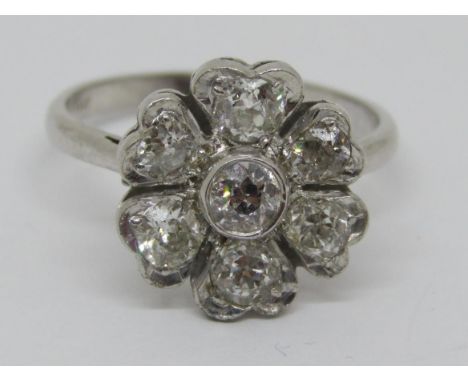 18ct white gold diamond cocktail ring in the form of a flower head, the centre stone 0.25cts approx, size R, 5.4g 