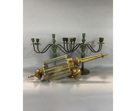Brass and lobed bevelled glass carriage lantern 67cm high together with a pair of patinated four branch candelabra (3) 